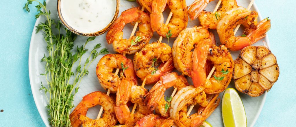 Grilled shrimp skewers with lemon butter marinade