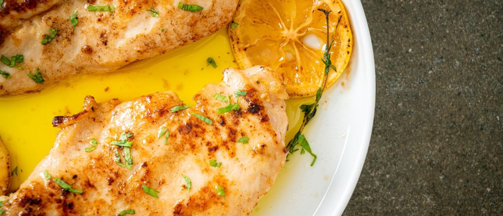 Grilled chicken breasts with lemon herb marinade