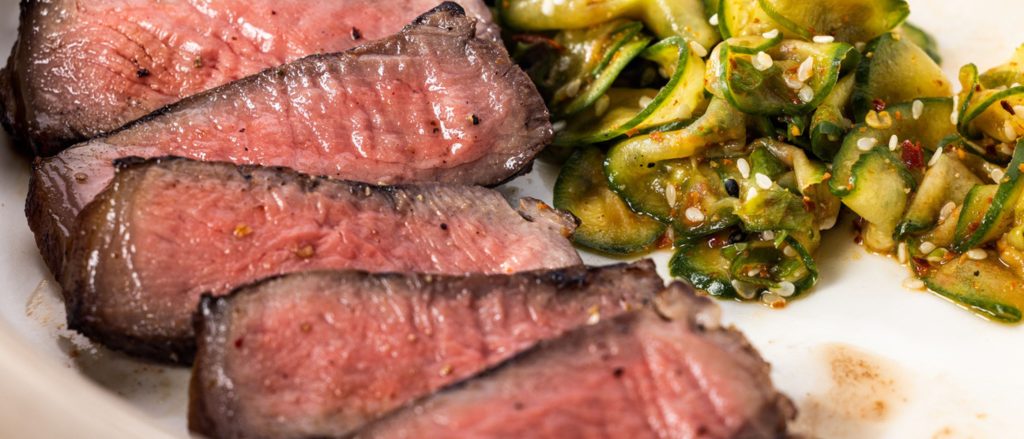 Perfectly grilled N.Y. strip steaks marinated in shio koji for a unique, savory flavor.