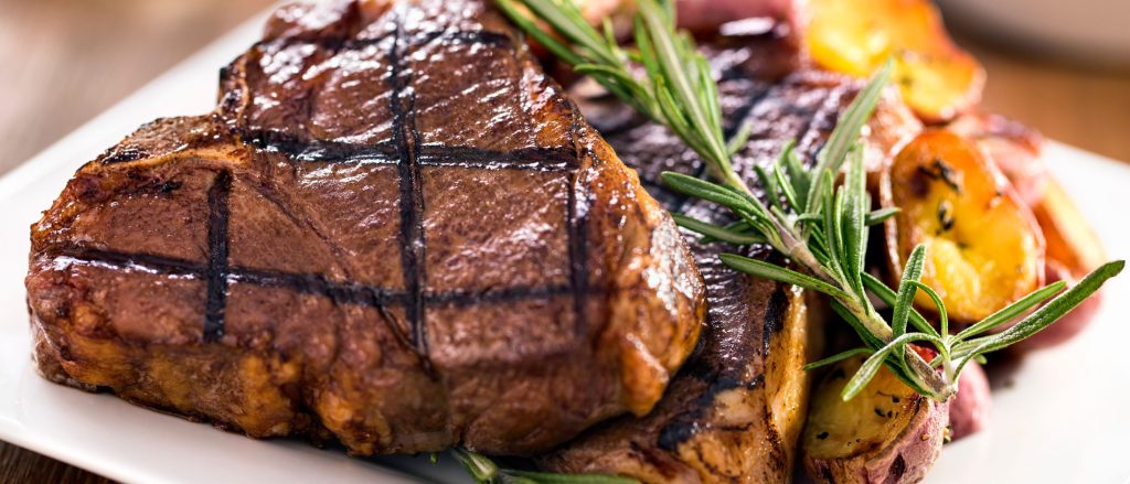 Juicy and tender grilled lamb chops infused with rosemary and garlic.