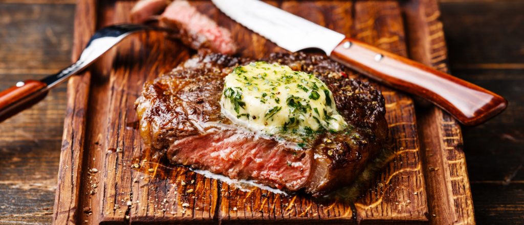 Grilled Denver steak topped with spiced Creole butter.