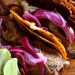 Steak tacos with red onion slices