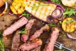 grilled meat and vegetable on booard